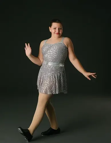 Tap dancer in sequin costume performing